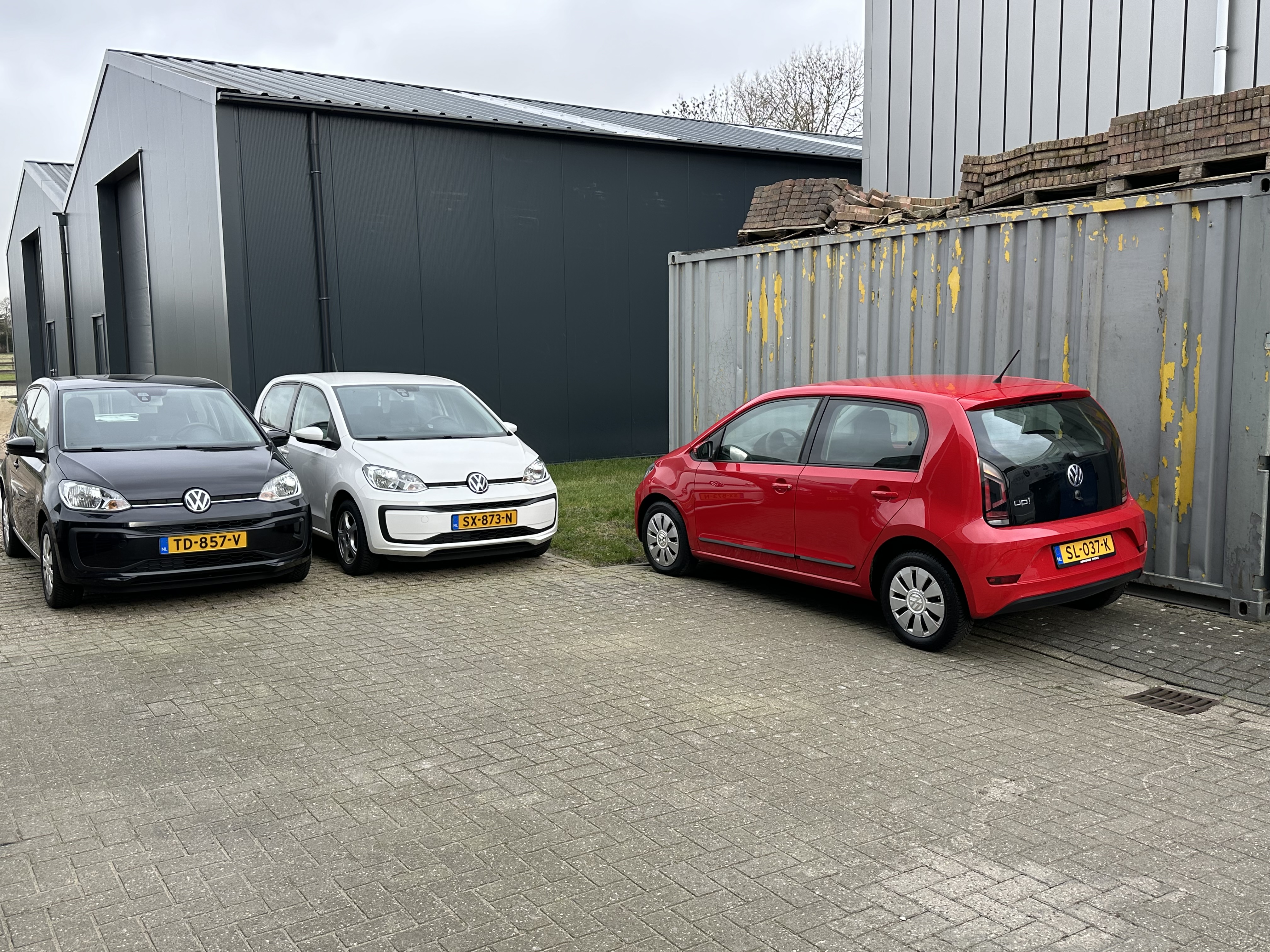 Three Up! cars at workshop
